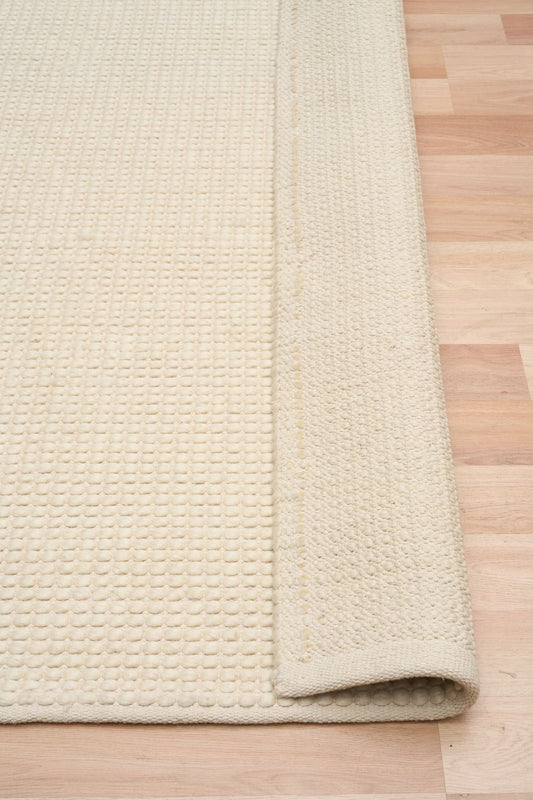 Dasha Runner - Cream is a texture hand woven rug runner made of 80% New Zealand Wool and 20% Polyester. Colour Beige. Size 80 X 320. Long Fold.