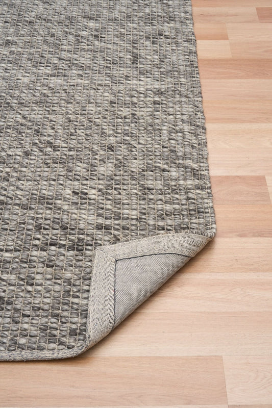 Dasha Runner - Dark Grey is a texture hand woven rug runner made of 80% New Zealand Wool and 20% Polyester. Colour Beige. Size 80 X 320. Fold.