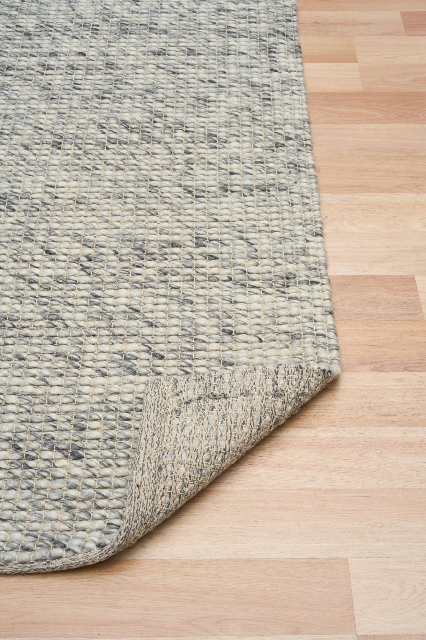 Dasha Runner - Grey is a texture hand woven rug runner made of 80% New Zealand Wool and 20% Polyester. Colour Beige. Size 80 X 320. Fold.