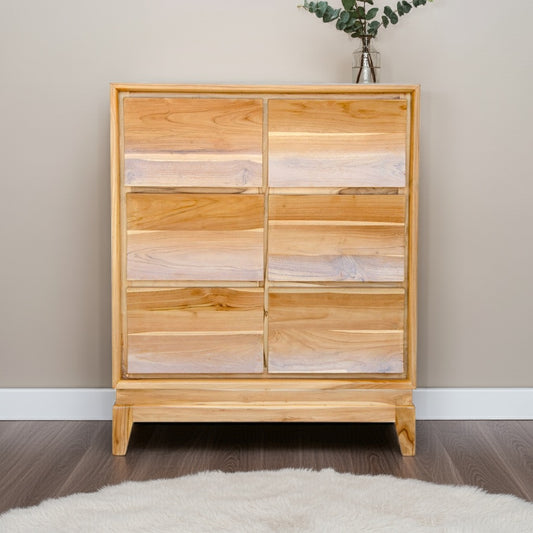 The Acadia 6 Drawer chest is crafted from  solid teak. Its contemporary design gives off a timeless aesthetic. Featuring 6 drawers in a 2 wide x 3 height configuration. Colour natural. Measures 900 Width X 1100 Height X 500 Depth. Styled.