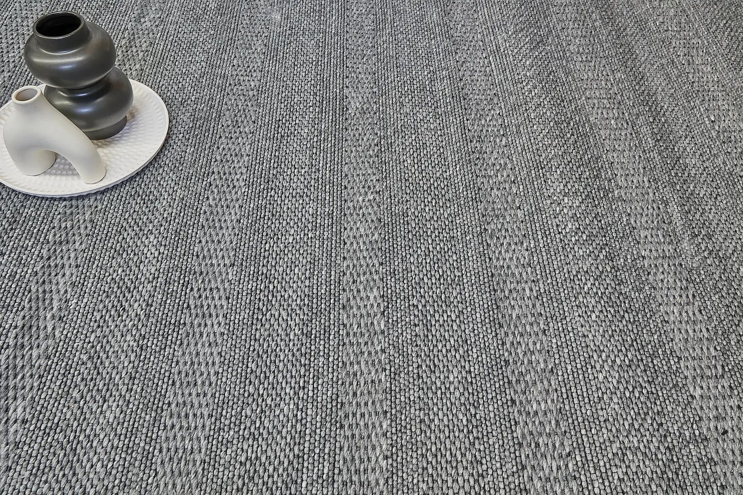 Albi Smoke is a Dark Grey and Black, PET Yarn (recycled Plastic) Hand woven rug. Sizes 160 X 230, 200 X 290 and 240 x 340. Life.