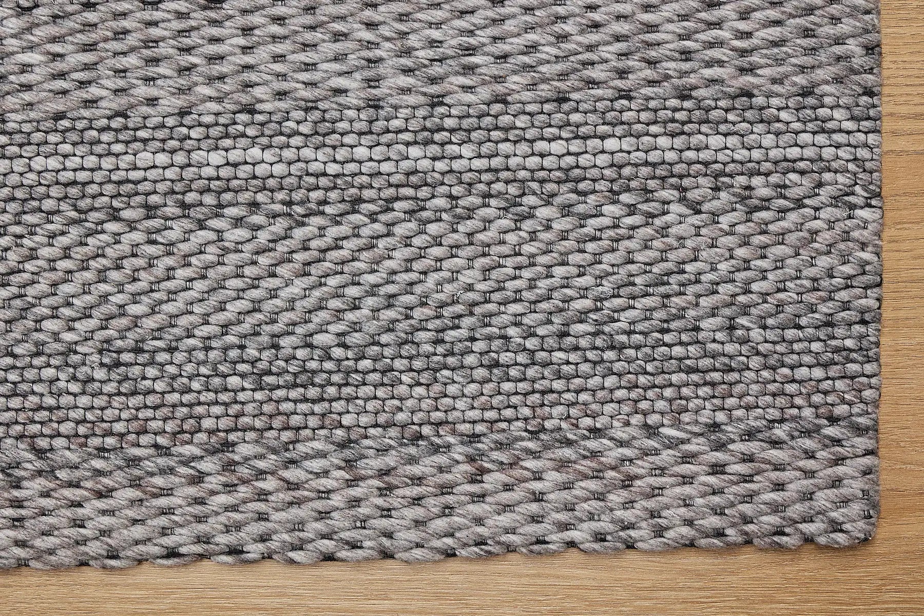 Albi Taupe is a Beige/Grey and Black, PET Yarn (recycled Plastic) Hand woven flatweave rug. Sizes 160 X 230, 200 X 290 and 240 x 340. Corner.