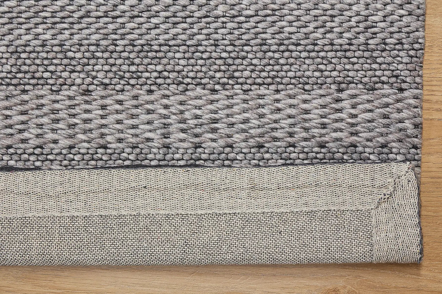 Albi Taupe is a Beige/Grey and Black, PET Yarn (recycled Plastic) Hand woven flatweave rug. Sizes 160 X 230, 200 X 290 and 240 x 340. Fold.