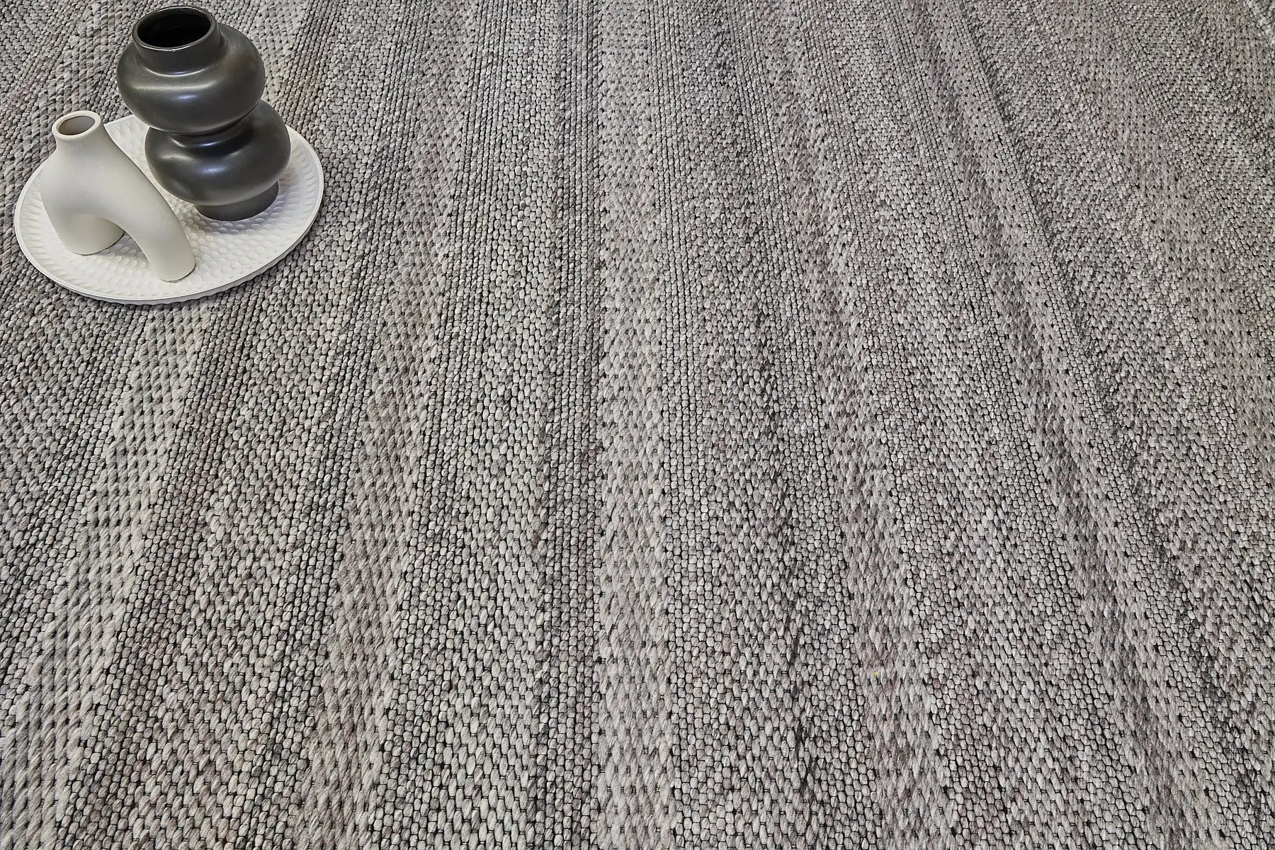 Albi Taupe is a Beige/Grey and Black, PET Yarn (recycled Plastic) Hand woven flatweave rug. Sizes 160 X 230, 200 X 290 and 240 x 340. Life.