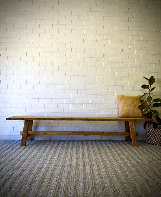 The Amchur 1700 Bench is crafted from sustainable recycled teak. Features a solid plank top with A-Frame legs and centre support beam. Colour Natural Teak. Measures 1700 Length x 330 Depth x 450 Height. Styled.