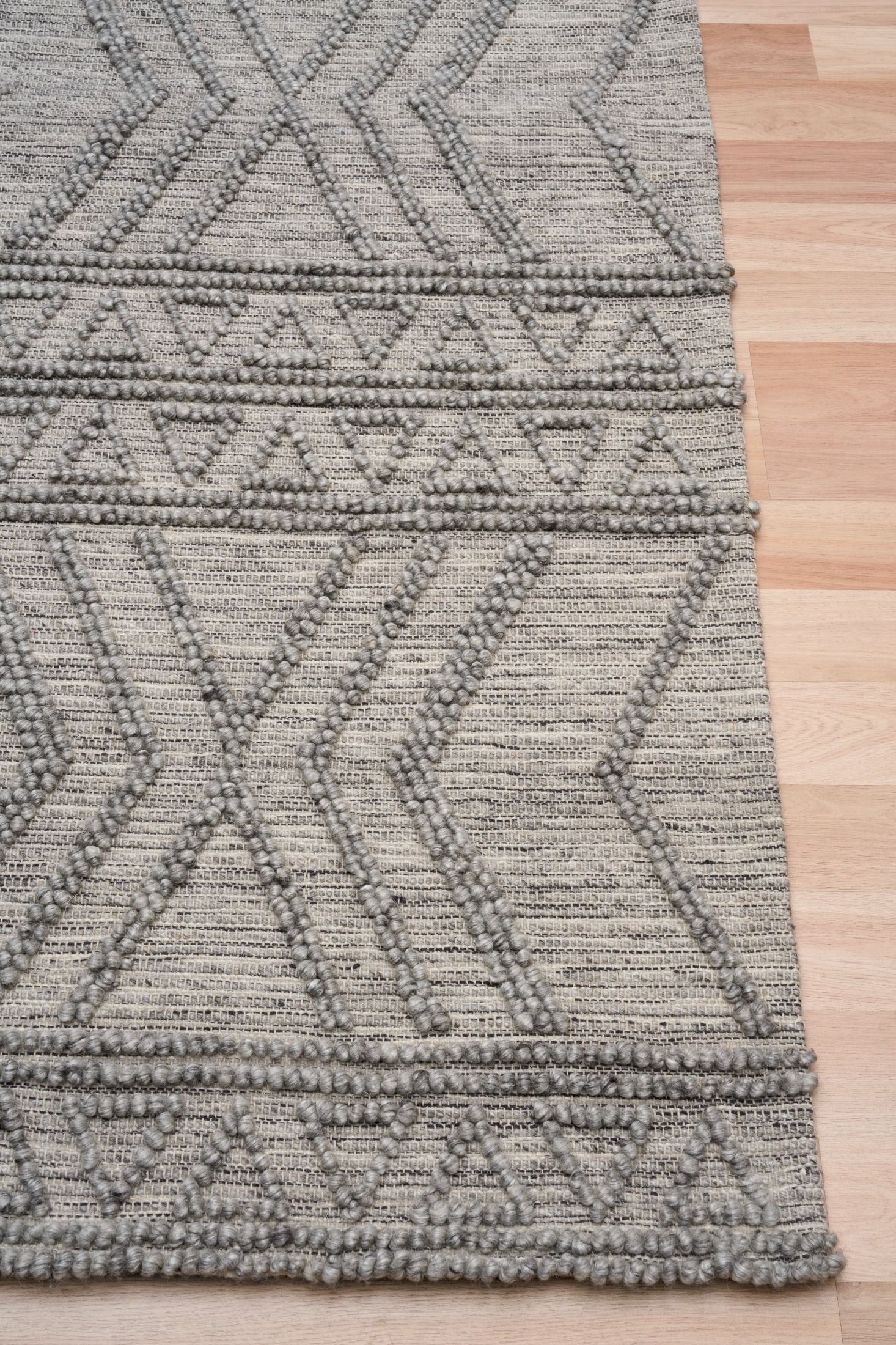 Anita-2 Grey is a hand woven textured wool rug. Featuring a tribal geometric design.  Colour Charcoal. Sizes 155 X 225, 200 X 290, 240 X 340 and 300 X 400. Corner.