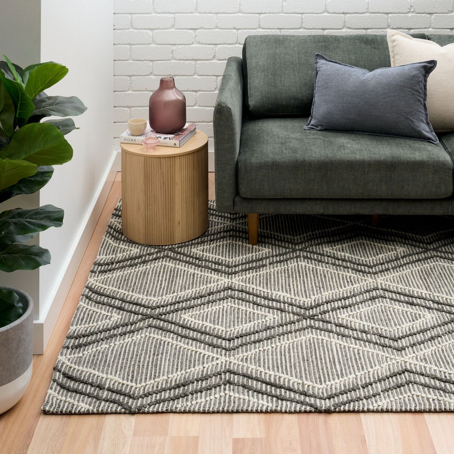 Anita Charcoal is a hand woven textured wool rug. Featuring a tribal geometric design with a 6-8mm pile height.  Colour Charcoal, Grey and White. Sizes 155 X 225, 200 X 290, 240 X 320 and 300 X 400. Life.