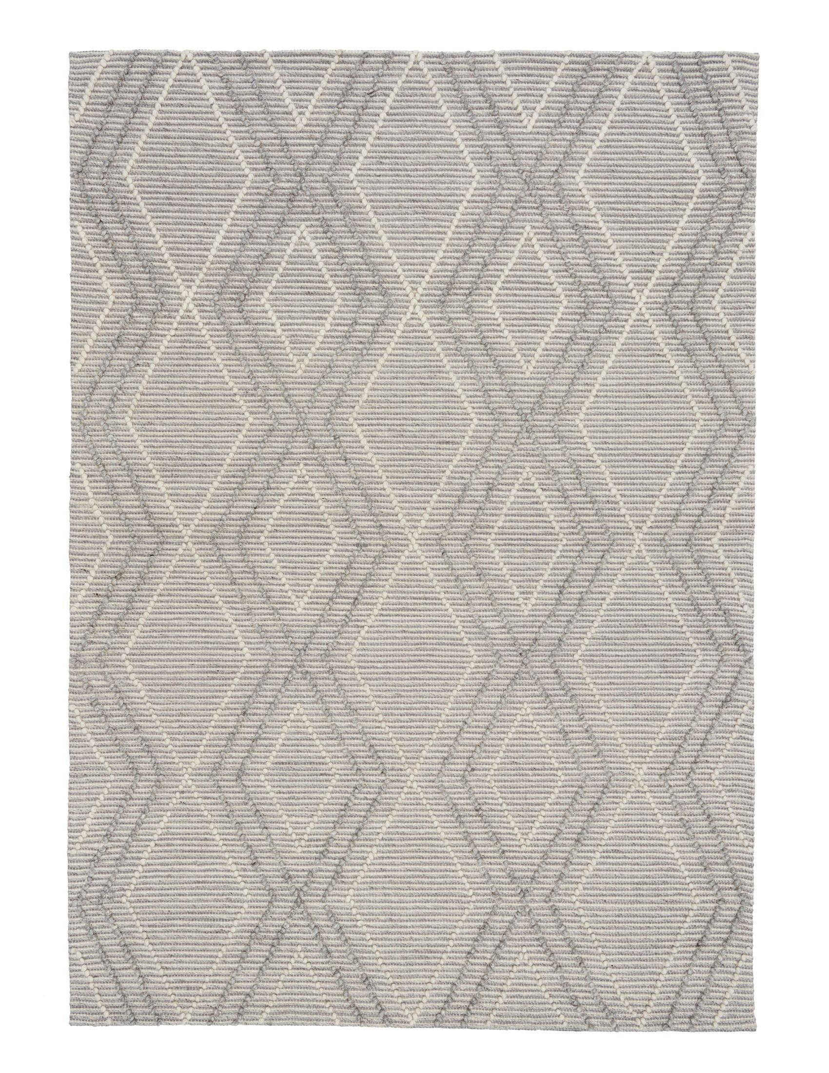 Anita Silver is a hand woven textured wool rug. Featuring a tribal geometric design with a 6-8mm pile height.  Colour Silver Grey, Grey and White. Sizes 155 X 225, 200 X 290, 240 X 320 and 300 X 400. Full
