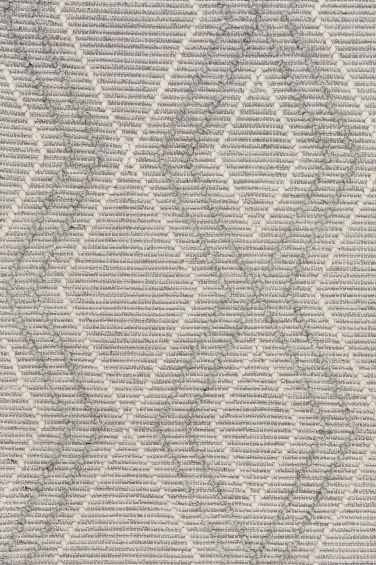 Anita Silver is a hand woven textured wool rug. Featuring a tribal geometric design with a 6-8mm pile height.  Colour Silver Grey, Grey and White. Sizes 155 X 225, 200 X 290, 240 X 320 and 300 X 400. Close.