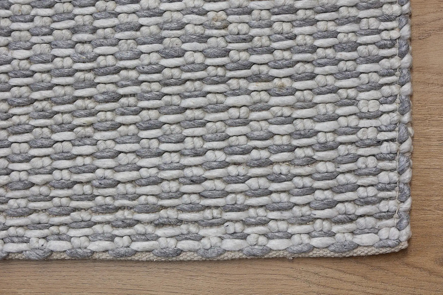 Ankara Grey is a Hand-woven, loop-textured rug crafted from a luxurious combination of wool and bamboo silk. Colours Light Grey and Grey. Sizes 160 X 230, 200 X 290, and 240 X 340. Corner.