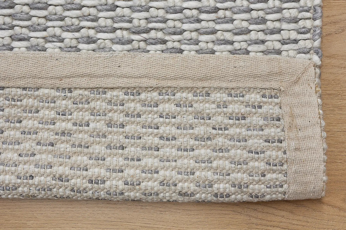 Ankara Grey is a Hand-woven, loop-textured rug crafted from a luxurious combination of wool and bamboo silk. Colours Light Grey and Grey. Sizes 160 X 230, 200 X 290, and 240 X 340. Fold.