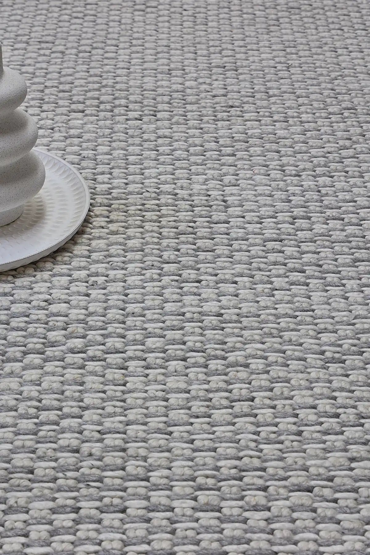 Ankara Grey is a Hand-woven, loop-textured rug crafted from a luxurious combination of wool and bamboo silk. Colours Light Grey and Grey. Sizes 160 X 230, 200 X 290, and 240 X 340. Life.