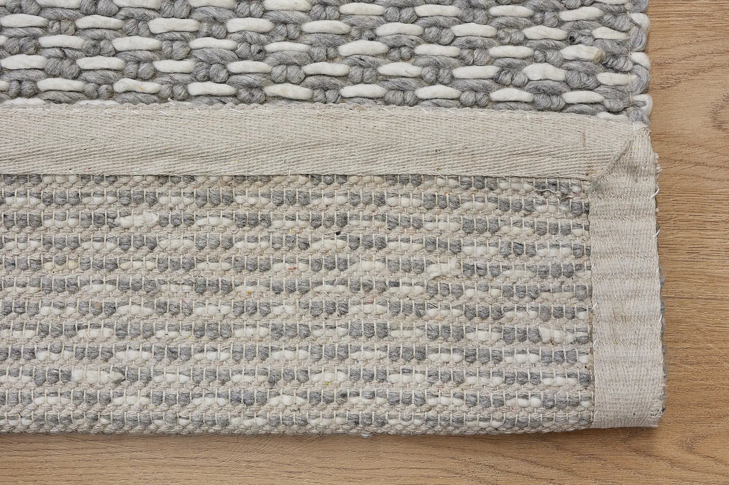 Ankara Silver is a Hand-woven, loop-textured rug crafted from a luxurious combination of wool and bamboo silk. Colours Silver and Grey. Sizes 160 X 230, 200 X 290, and 240 X 340. Fold.