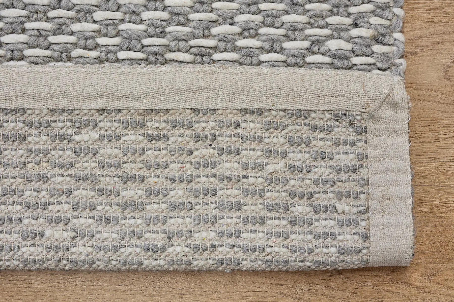 Ankara Silver is a Hand-woven, loop-textured rug crafted from a luxurious combination of wool and bamboo silk. Colours Silver and Grey. Sizes 160 X 230, 200 X 290, and 240 X 340. Fold.