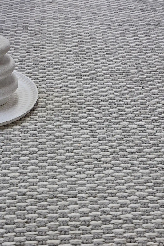 Ankara Silver is a Hand-woven, loop-textured rug crafted from a luxurious combination of wool and bamboo silk. Colours Silver and Grey. Sizes 160 X 230, 200 X 290, and 240 X 340. Life.