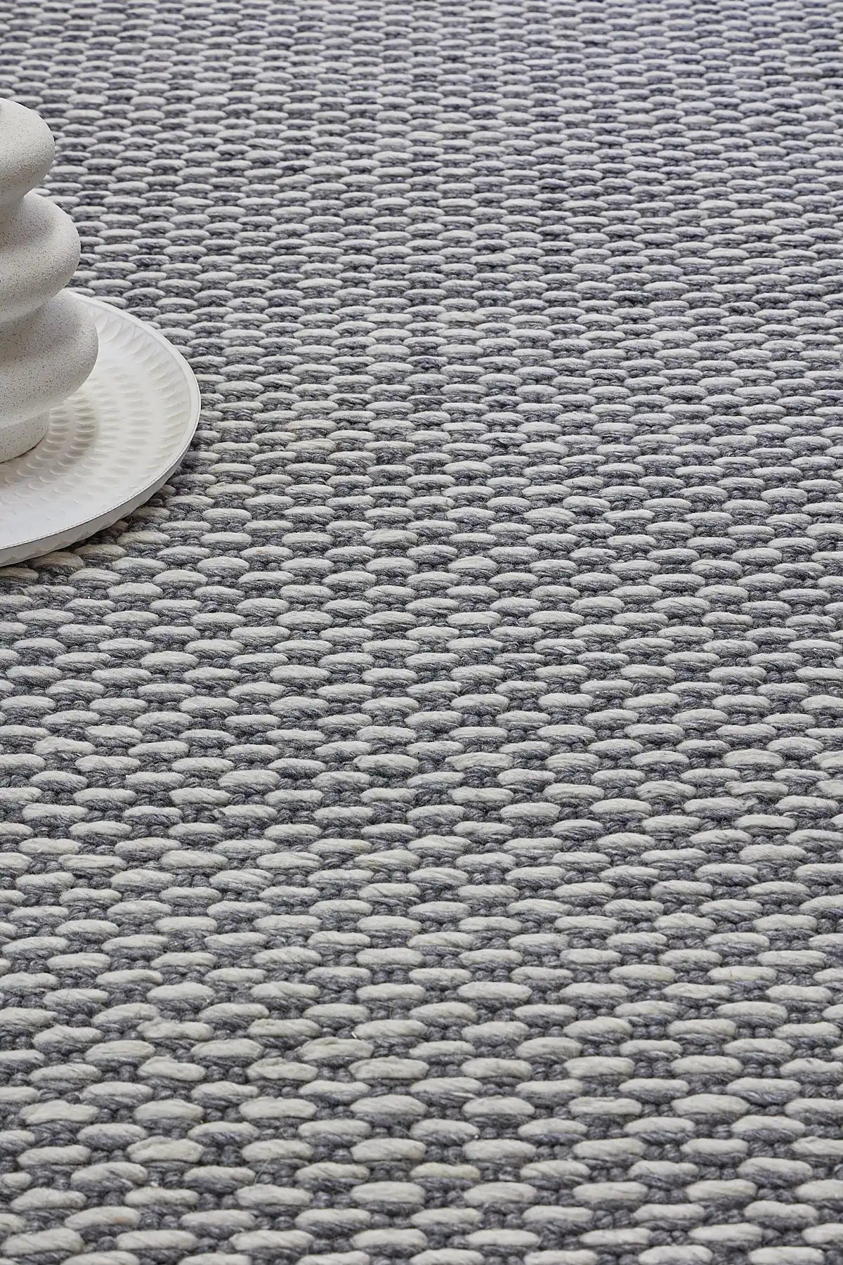 Ankara Smoke is a Hand-woven, loop-textured rug crafted from a luxurious combination of wool and bamboo silk. Colours Dark Grey and Light Grey. Sizes 160 X 230, 200 X 290, and 240 X 340. Life.