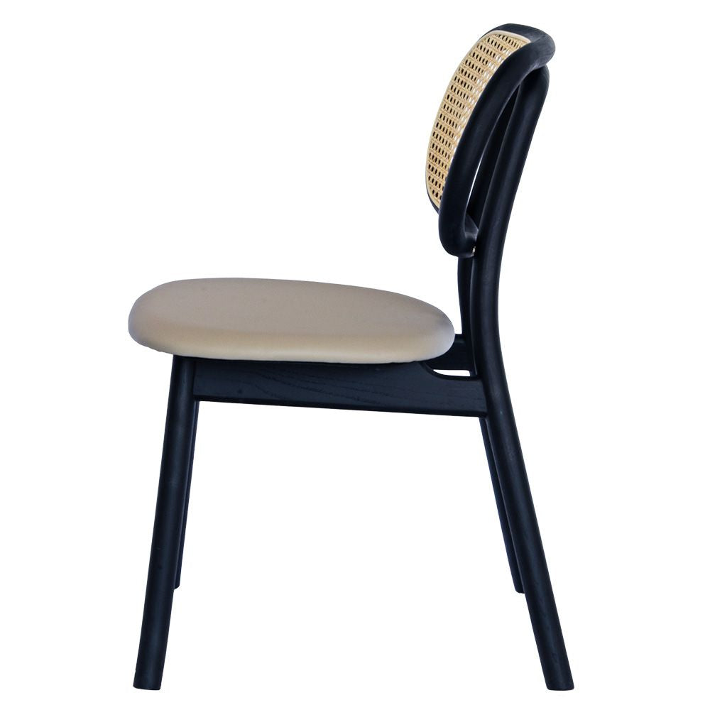 The Apache Black Dining Chair is a coastal/contemporary dining chair.  Crafted with solid ash frame, polyurethane seat and a rattan back. Colours Black Frame, Grey Polyurethane seat and natural rattan seat back. Measuring 530 wide x 550 depth x 450 seat height and a back height of 780. Side Plain.