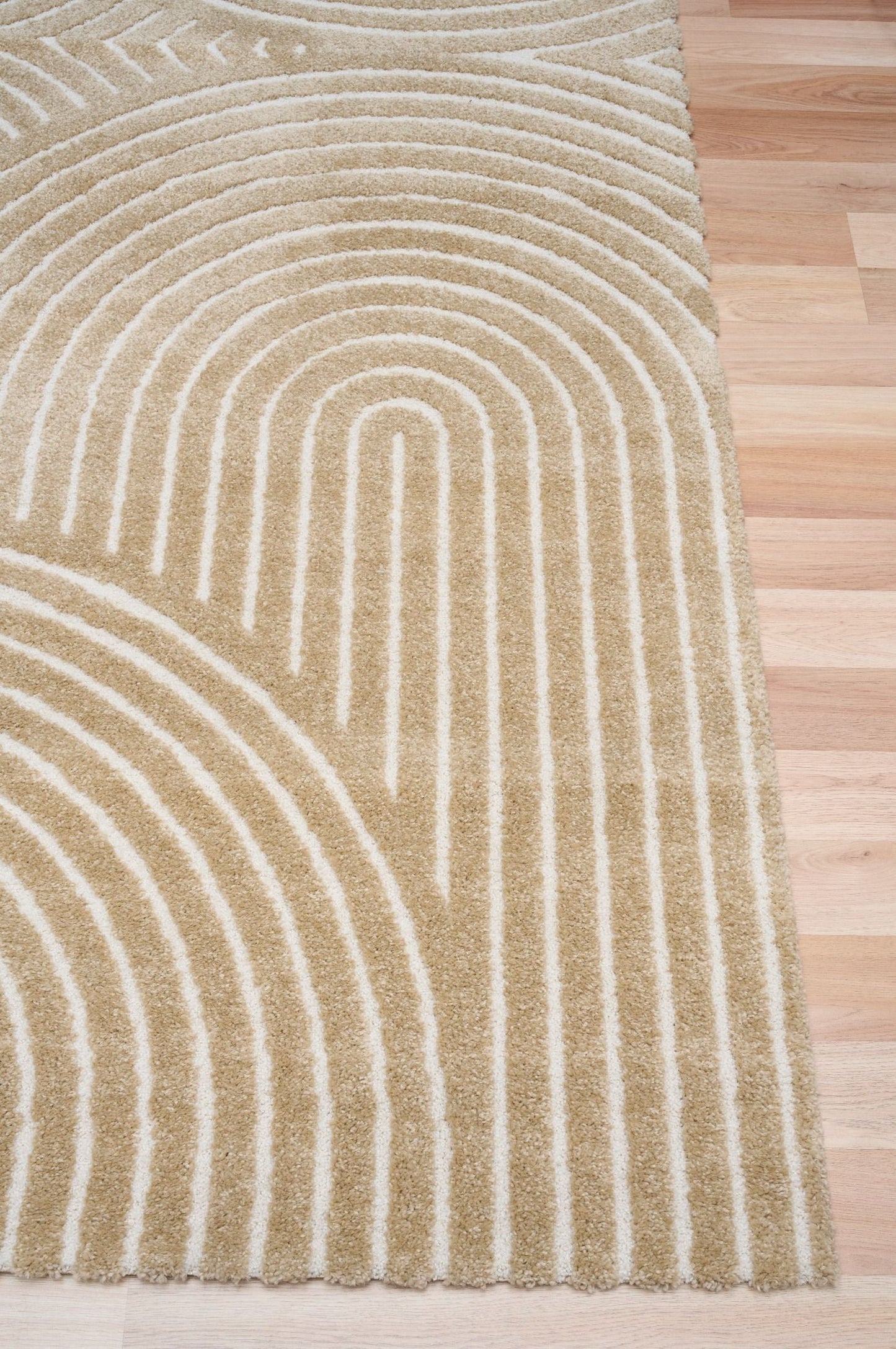 Arches - Beige, a modern rug design crafted with a unique blend of Heat Set Polypropylene and Polyester shrink yarn. Corner.