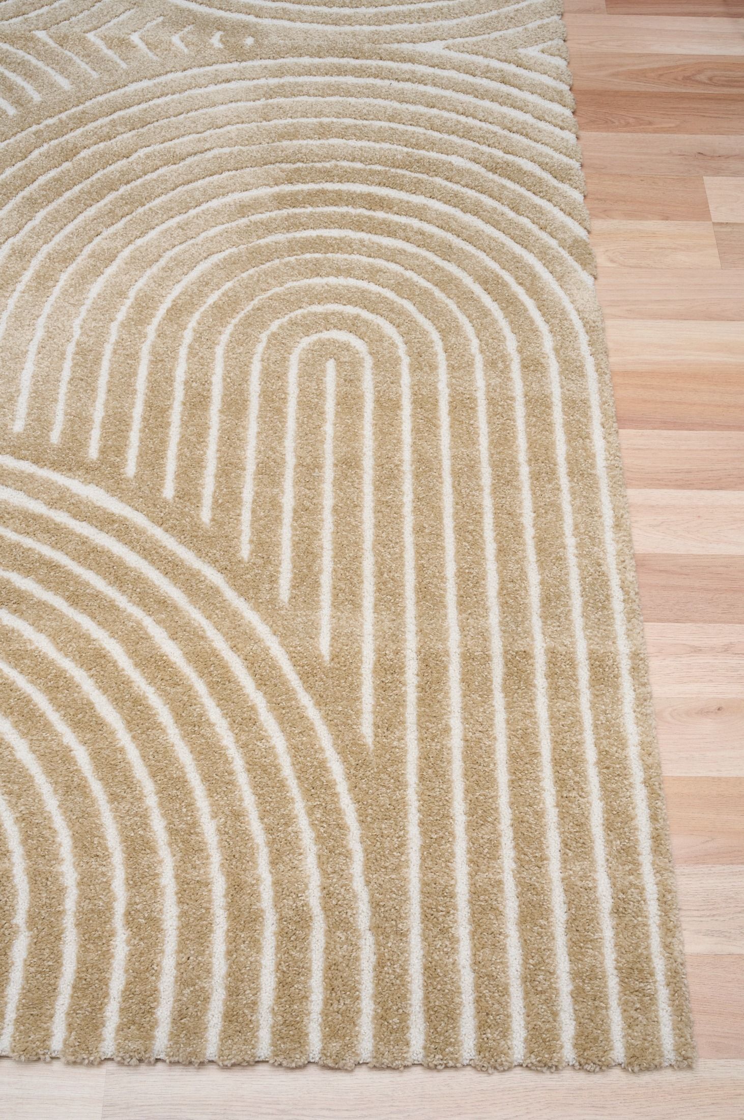 Arches - Beige, a modern rug design crafted with a unique blend of Heat Set Polypropylene and Polyester shrink yarn. Corner.