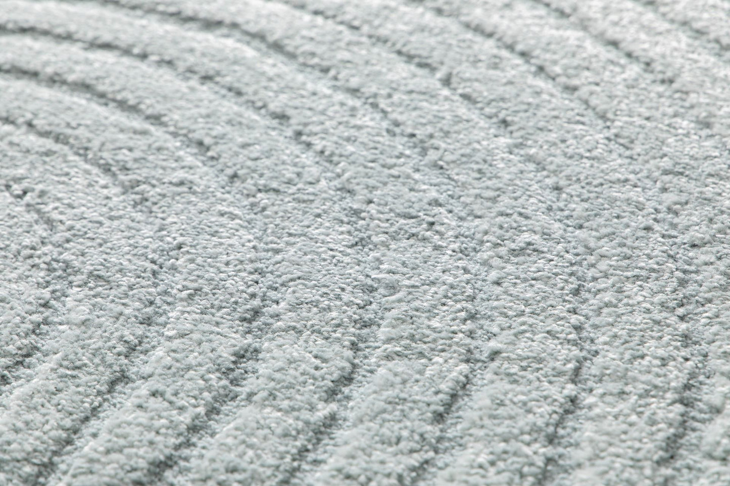 Arches - Light Blue, a modern rug design crafted with a unique blend of Heat Set Polypropylene and Polyester shrink yarn. Angle Close.