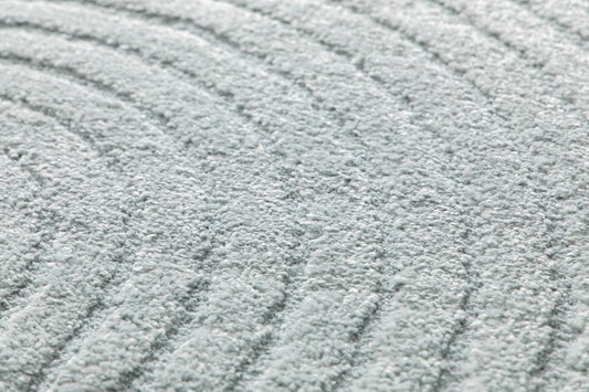 Arches - Light Blue, a modern rug design crafted with a unique blend of Heat Set Polypropylene and Polyester shrink yarn. Angle Close.