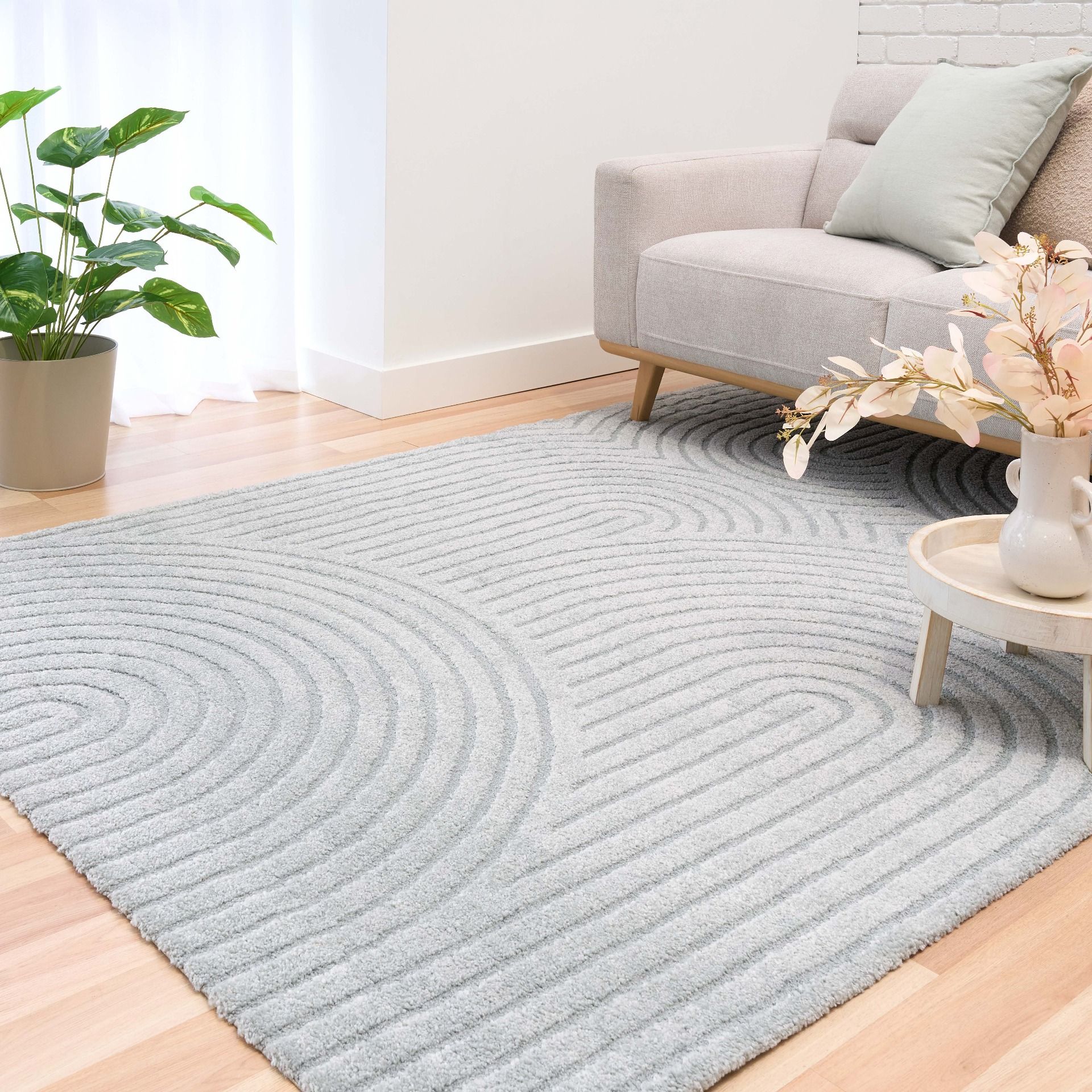 Arches - Light Blue, a modern rug design crafted with a unique blend of Heat Set Polypropylene and Polyester shrink yarn.  Life.
