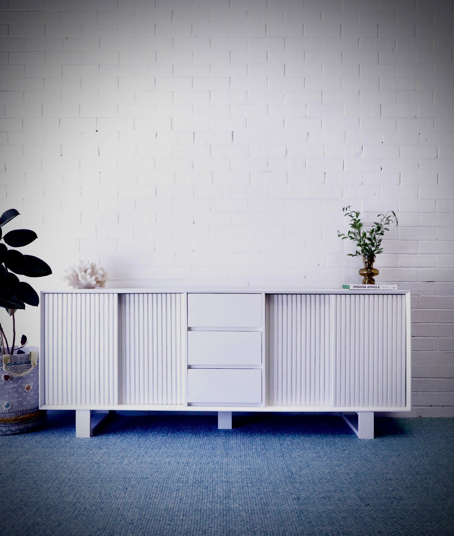 The Ashland 2 Sliding Door 3 Drawer - White Buffet - a Coastal Contemporary Teak Buffet. Featuring 2 sliding doors, and 3 drawers, supported by wooden runners. Measures 1800 Length X 400 Depth X 900 Height. Styled.