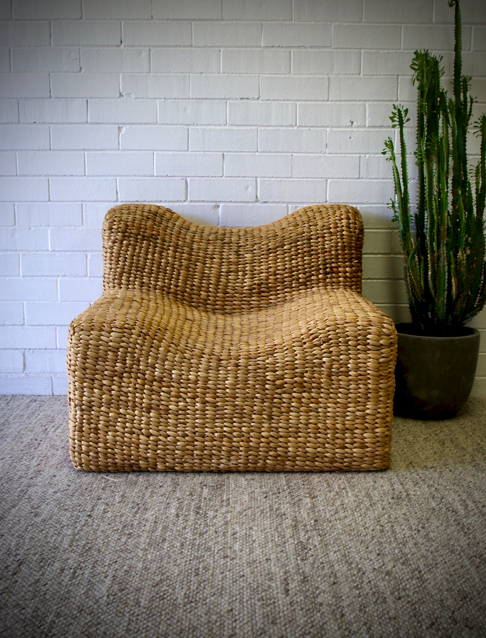 The Aster Occasional Chair is an indoor/outdoor lounge chair crafted from banana leaf.  Colour Natural Brown. Measures 800 Wide x 820 Depth x 650 Height. Front Styled.