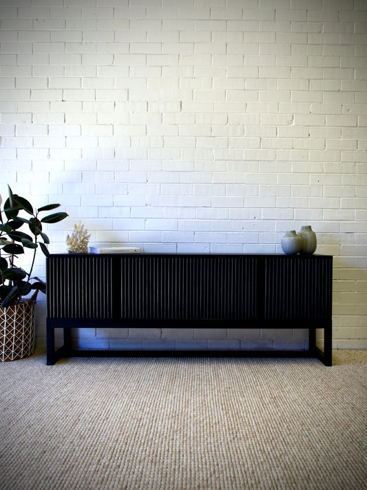 The Astoria 4 Door Black buffet is a contemporary styled piece. Crafted from sustainable white cedar, it features 4 textured doors. Colour Black. Measures 1800 length X 400 depth X 700 height. Front Styled.