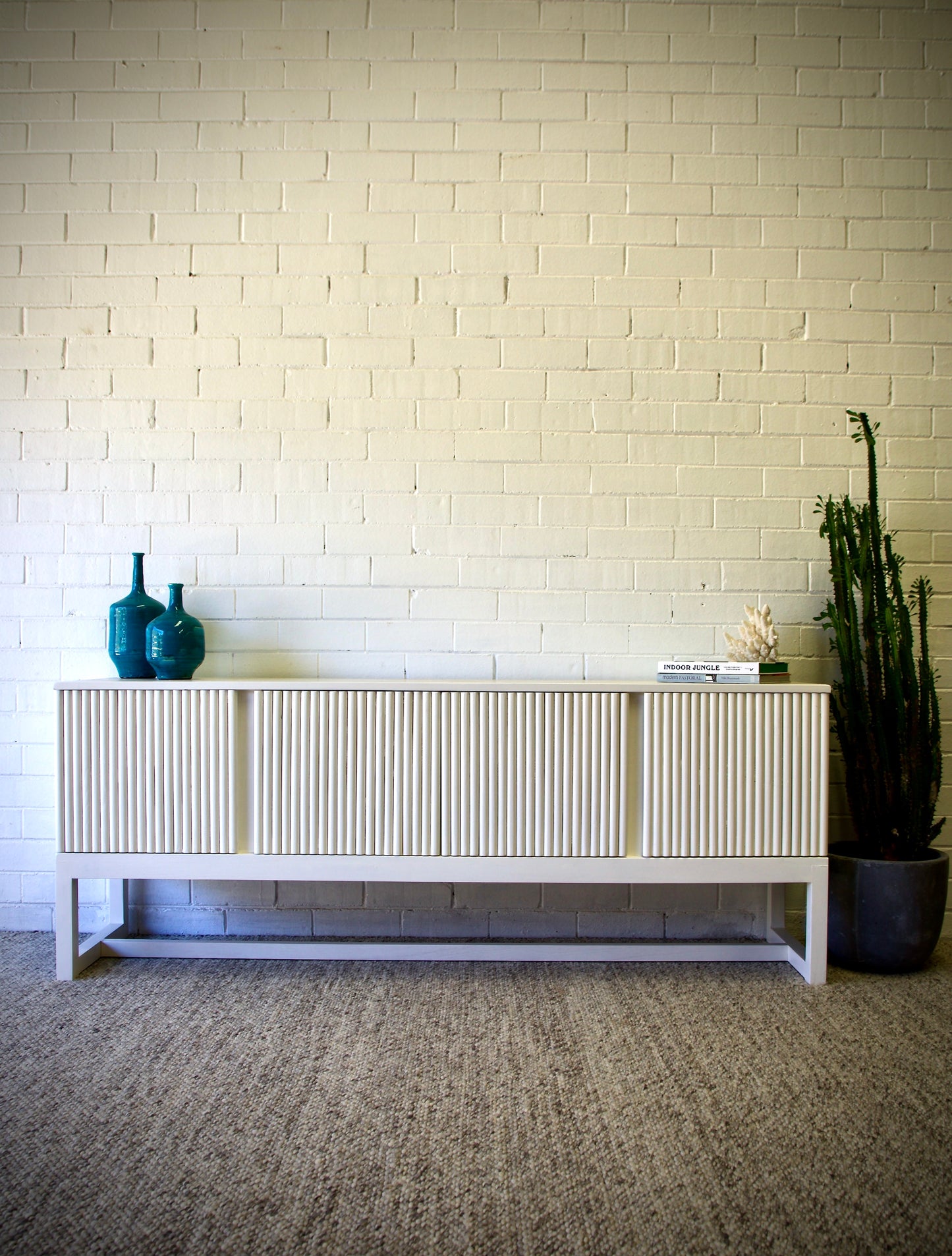The Astoria 4 Door White buffet is a contemporary styled piece. Crafted from sustainable white cedar, it features 4 textured doors. Colour White. Measures 1800 length X 400 depth X 700 height. Front Styled.