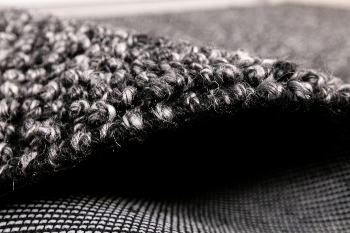 Avenue Charcoal is a hand woven PET Yarn (Recycled Plastics) Rug.  It features a soft wool-like feel with a modern/contemporary design.  Colour Charcoal. Sizes 155 X 225, 200 X 290, 240 X 320 and 300 X 400. Side.