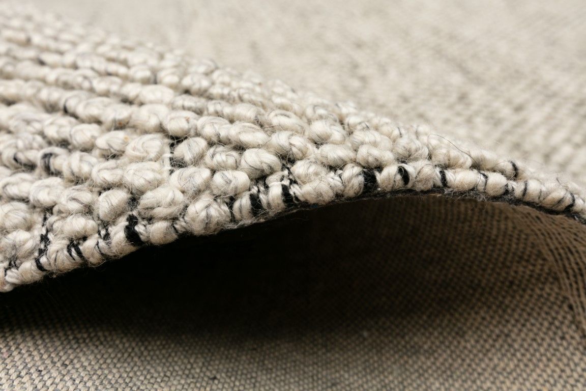 Avenue Timeless Grey is a hand woven PET Yarn (Recycled Plastics) Rug.  It features a soft wool-like feel with a modern/contemporary design.  Colours Light Grey, White with Black accents. Sizes 155 X 225, 200 X 290, 240 X 320 and 300 X 400. Side.