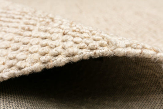 The Avenue 160 Round Cream Rug in durable PET yarn with a wool-like feel. Size 160 Diameter. Side.