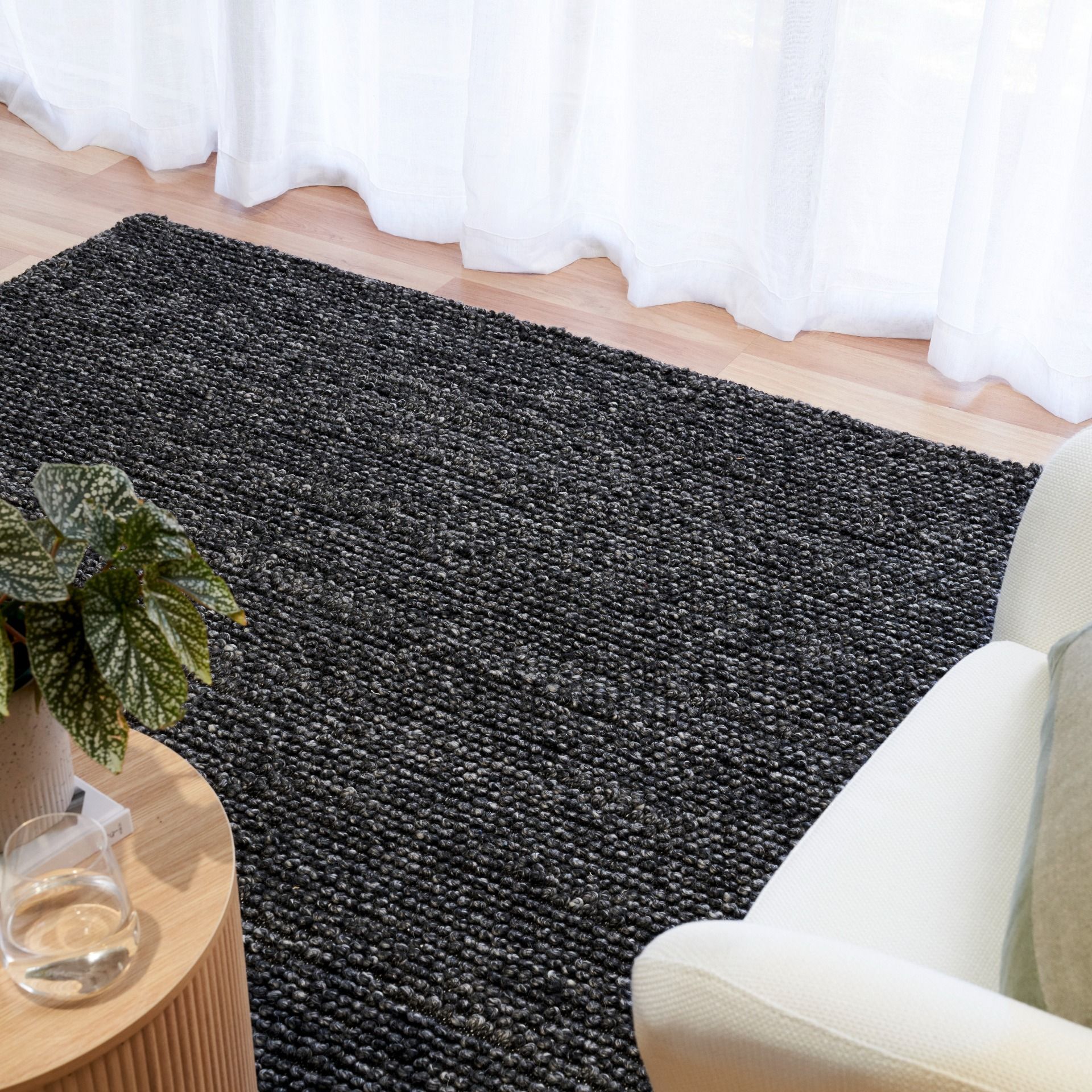Avenue Charcoal is a hand woven PET Yarn (Recycled Plastics) Rug.  It features a soft wool-like feel with a modern/contemporary design.  Colour Charcoal. Sizes 155 X 225, 200 X 290, 240 X 320 and 300 X 400. Styled.