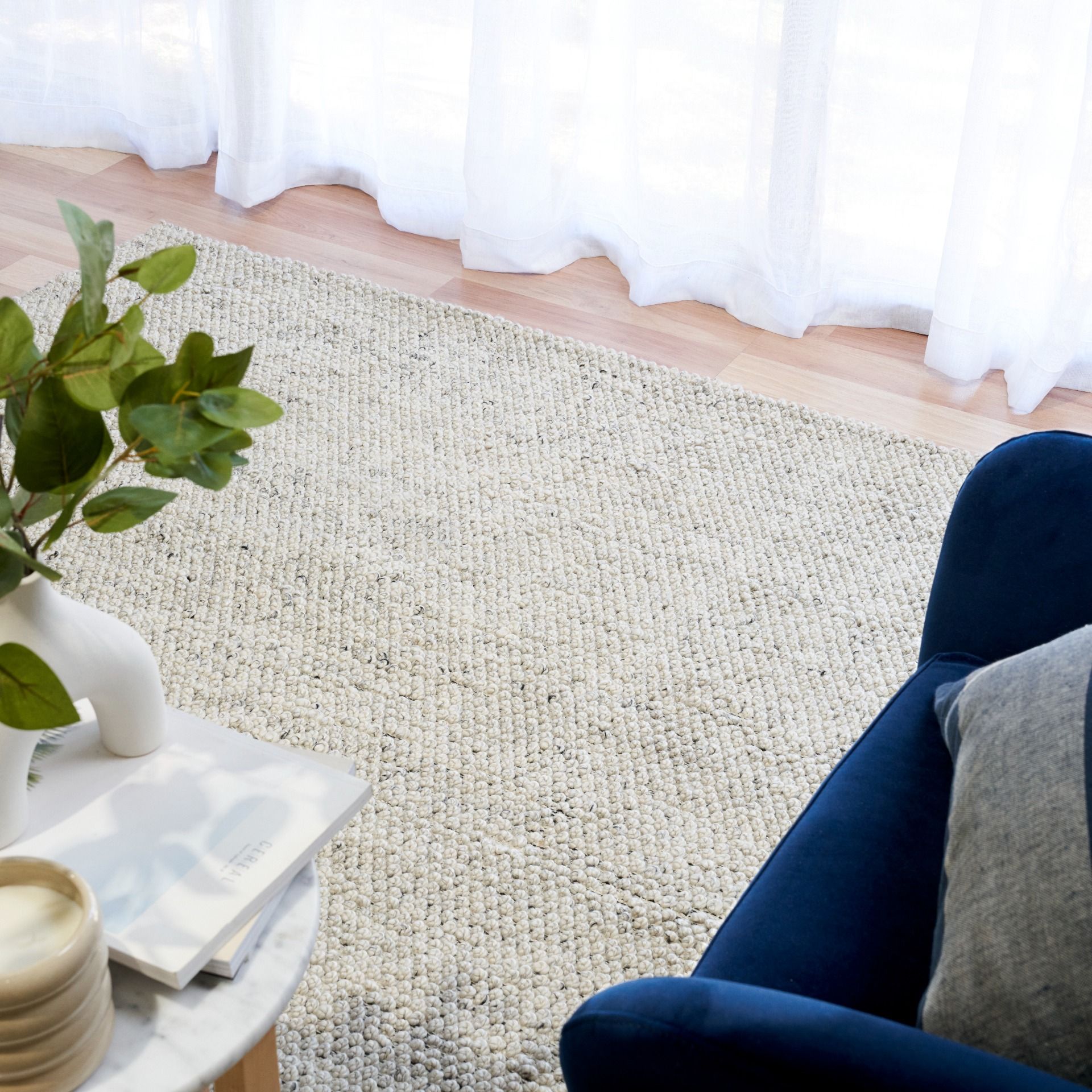 Avenue Timeless Grey is a hand woven PET Yarn (Recycled Plastics) Rug.  It features a soft wool-like feel with a modern/contemporary design.  Colours Light Grey, White with Black accents. Sizes 155 X 225, 200 X 290, 240 X 320 and 300 X 400. Styled.