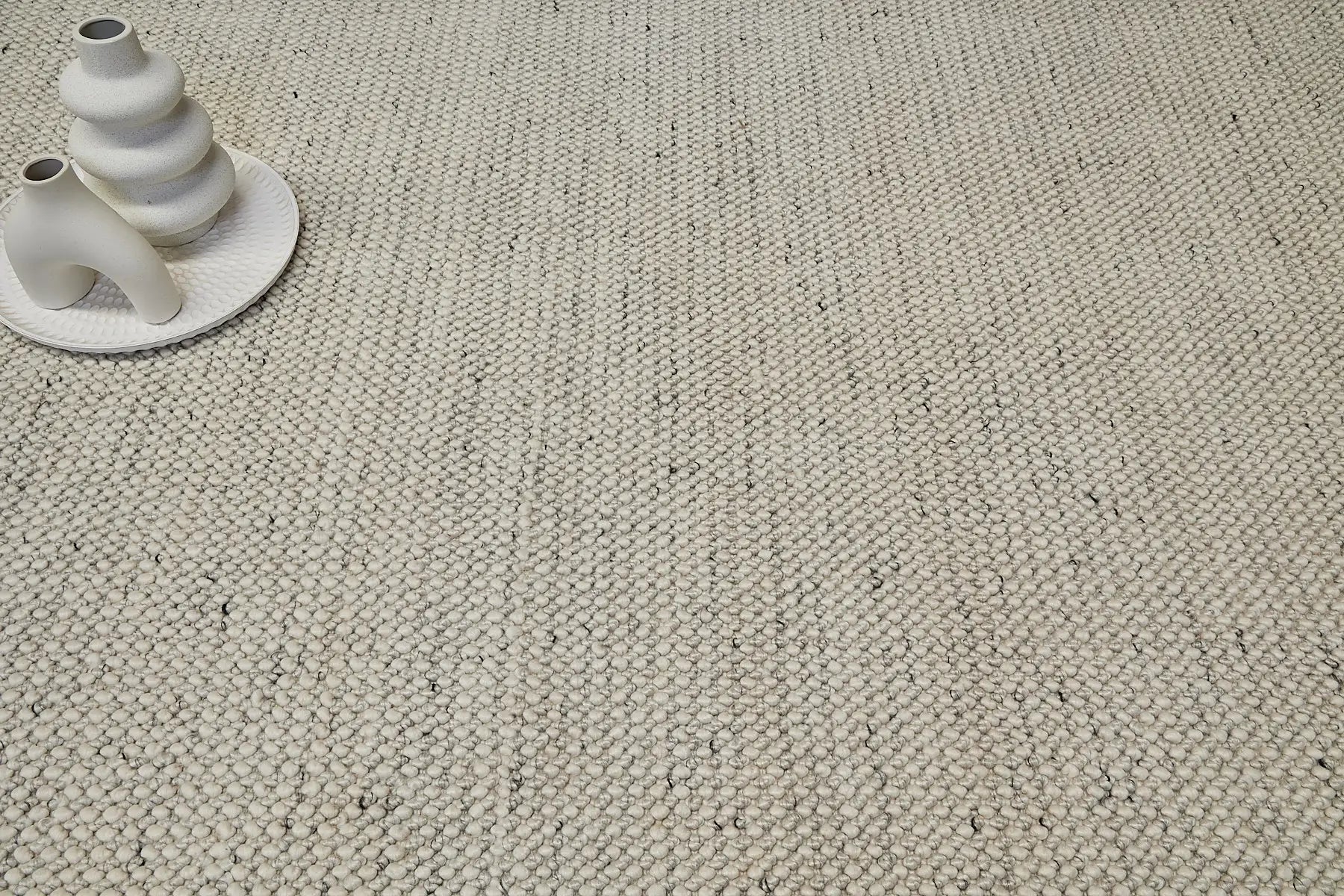 Avila - Natural is a handwoven loop piled carpet. It features a blend of fine wool and viscose, with a pile height of 16-18mm. Colours Cream with Brown and Beige accents. Sizes 160 X 230, 200 X 290 and 240 X 340. Life