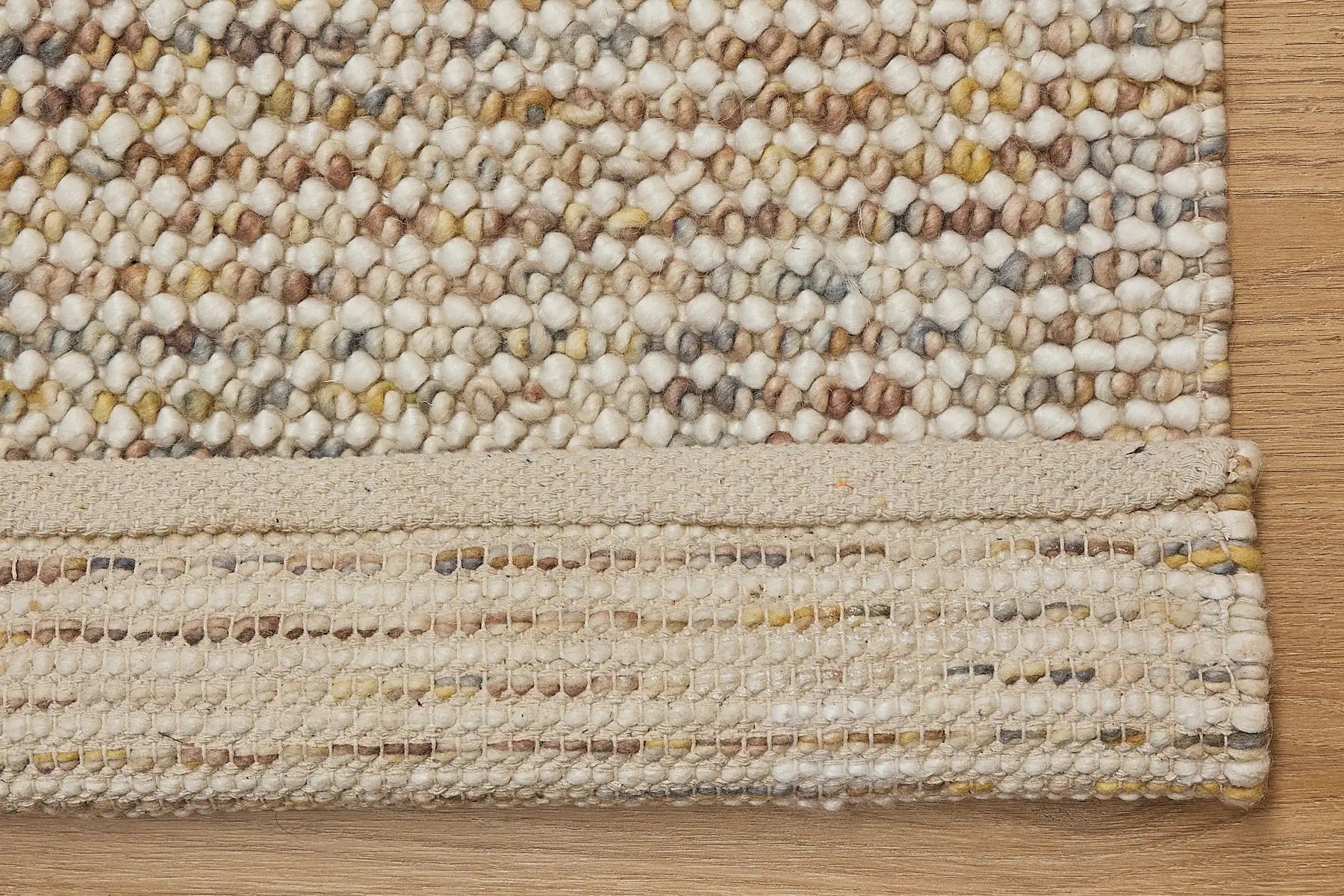 Avila - Sand is a handwoven loop piled carpet. It features a blend of fine wool and viscose, with a pile height of 16-18mm. Colours Cream with Brown, Beiege and Yellow accents. Sizes 160 X 230, 200 X 290 and 240 X 340. Fold.