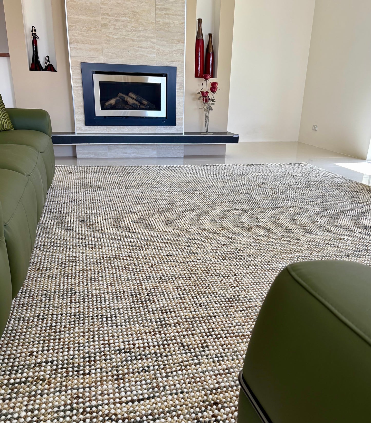 Avila - Beige is a handwoven loop piled carpet. It features a blend of fine wool and viscose, with a pile height of 16-18mm. Colours Beige with Brown accents. Sizes 160 X 230, 200 X 290, 240 X 340 and 300 X 400. Styled.