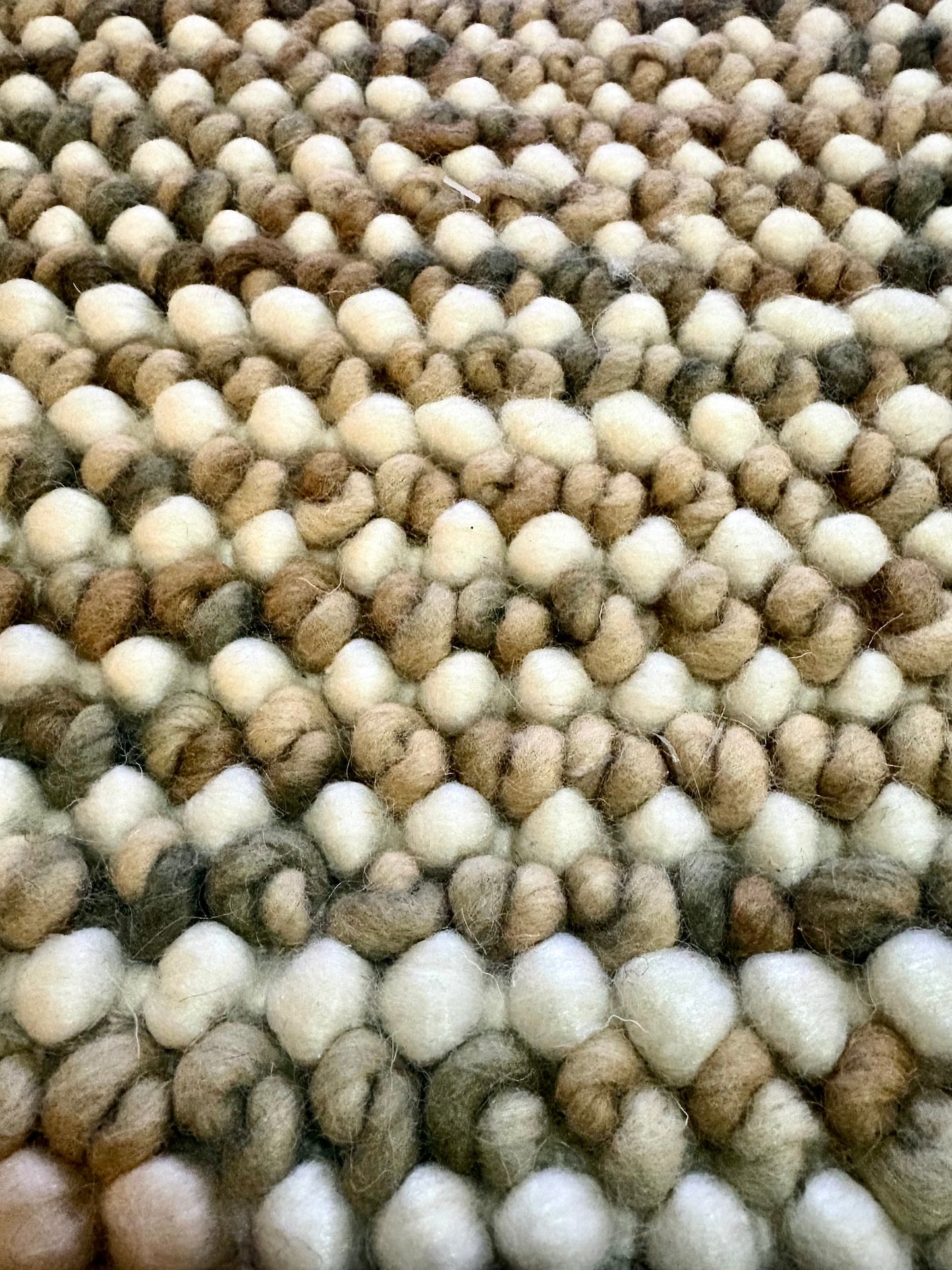 Avila - Beige is a handwoven loop piled carpet. It features a blend of fine wool and viscose, with a pile height of 16-18mm. Colours Beige with Brown accents. Sizes 160 X 230, 200 X 290, 240 X 340 and 300 X 400. Close.