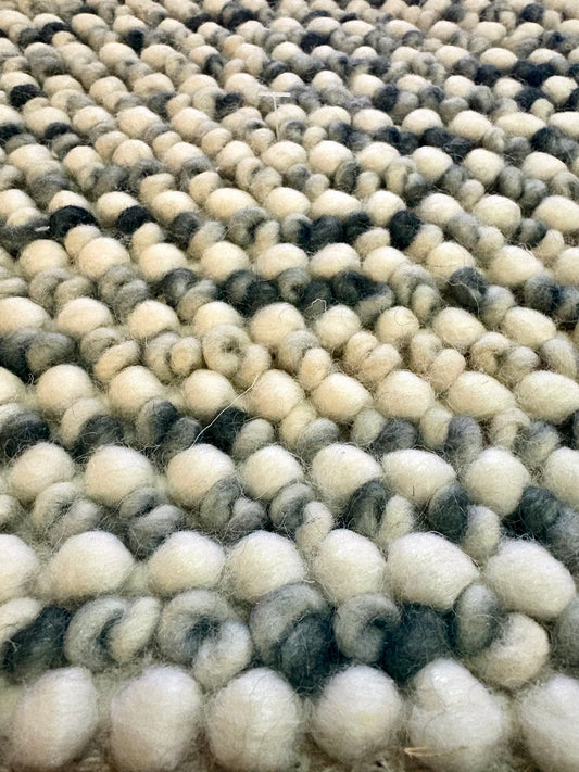 Avila - Forrest is a handwoven loop piled carpet. It features a blend of fine wool and viscose, with a pile height of 16-18mm. Colours White with Forrest Green accents. Sizes 160 X 230, 200 X 290, 240 X 340 and 300 X 400. Close.