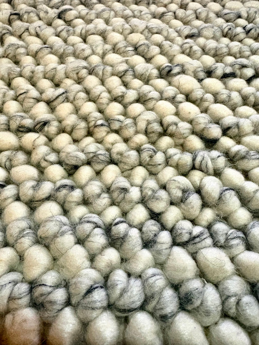 Avila - Natural is a handwoven loop piled carpet. It features a blend of fine wool and viscose, with a pile height of 16-18mm. Colours Cream with Brown and Beige accents. Sizes 160 X 230, 200 X 290, 240 X 340 and 300 X 400. Close.