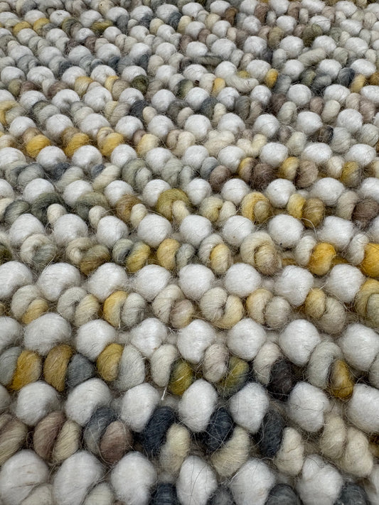 Avila - Sand is a handwoven loop piled carpet. It features a blend of fine wool and viscose, with a pile height of 16-18mm. Colours Cream with Brown, Beige and Yellow accents. Sizes 160 X 230, 200 X 290, 240 X 340 and 300 X 400. Close.