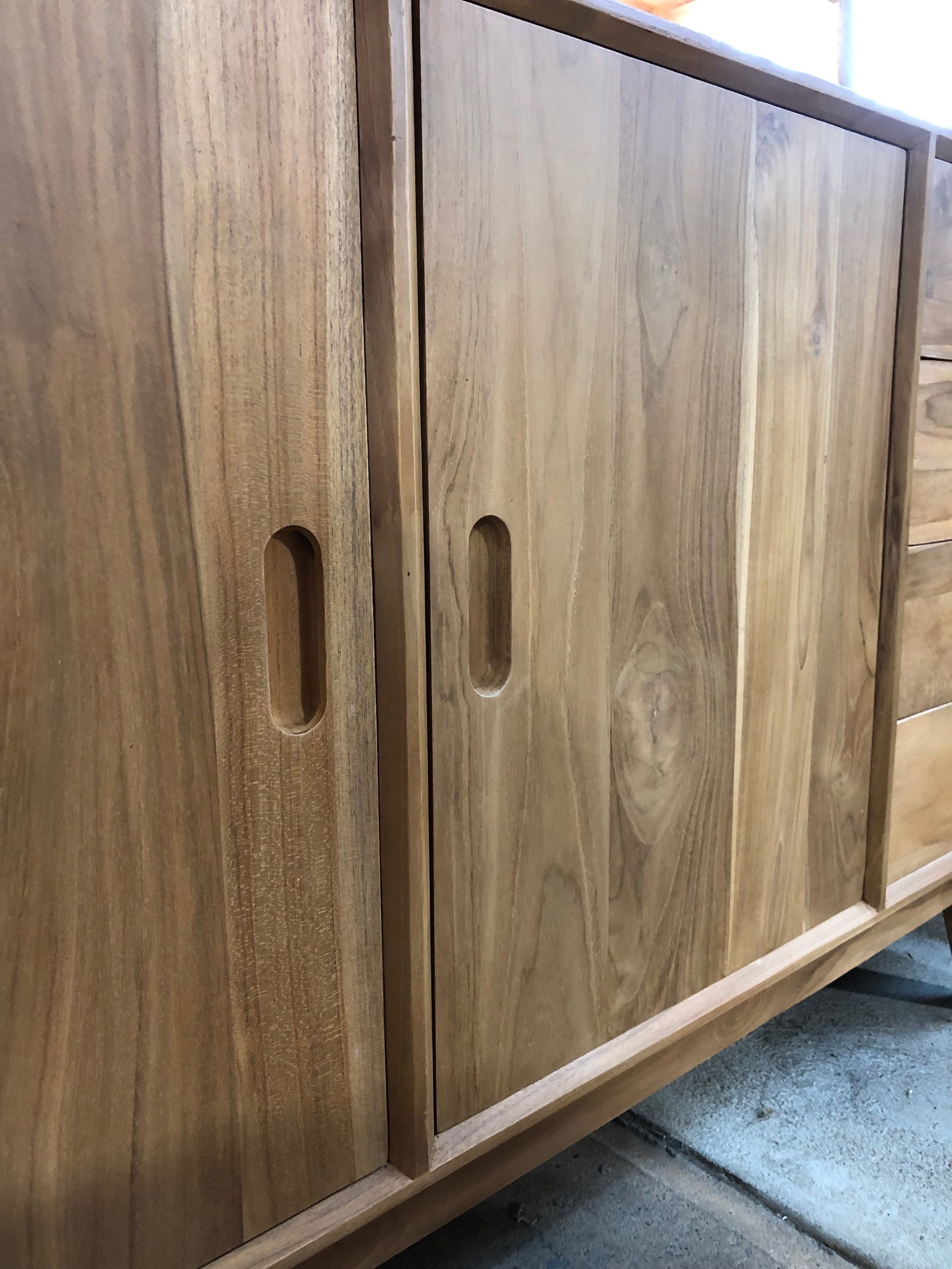 The Bandon - Buffet. Crafted from solid, sustainable teak, this 2 door, 8 drawer buffet adds both functionality and style to your living space. Measures 1800 Length X 400 Depth X 800 Height. Doors.