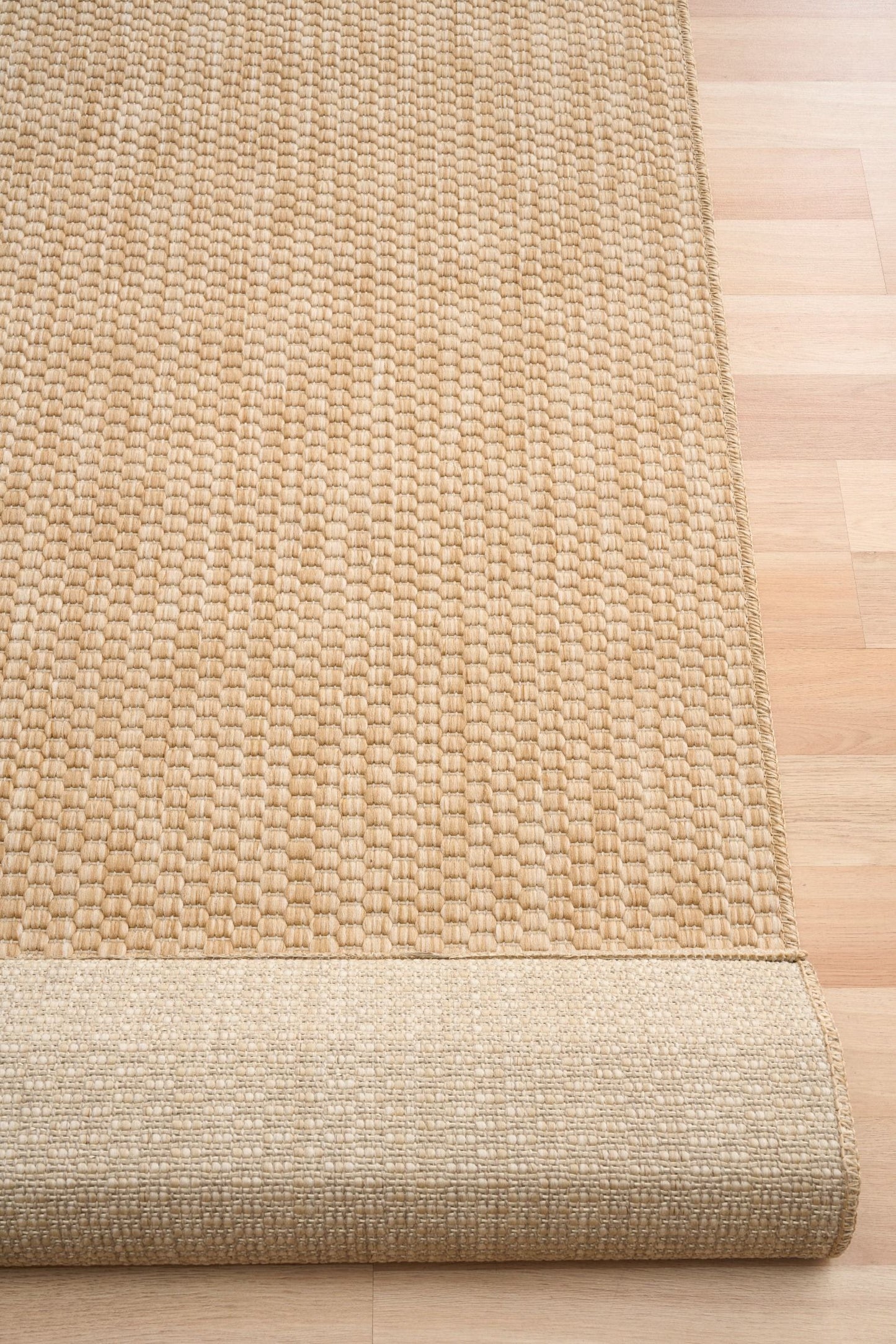 Barton Beige 41503 indoor/outdoor rug featuring soft beige tones and a subtle textured pattern, power-loomed from UV-stabilised polypropylene for lasting durability. Colour beige. 3 sizes. Fold.