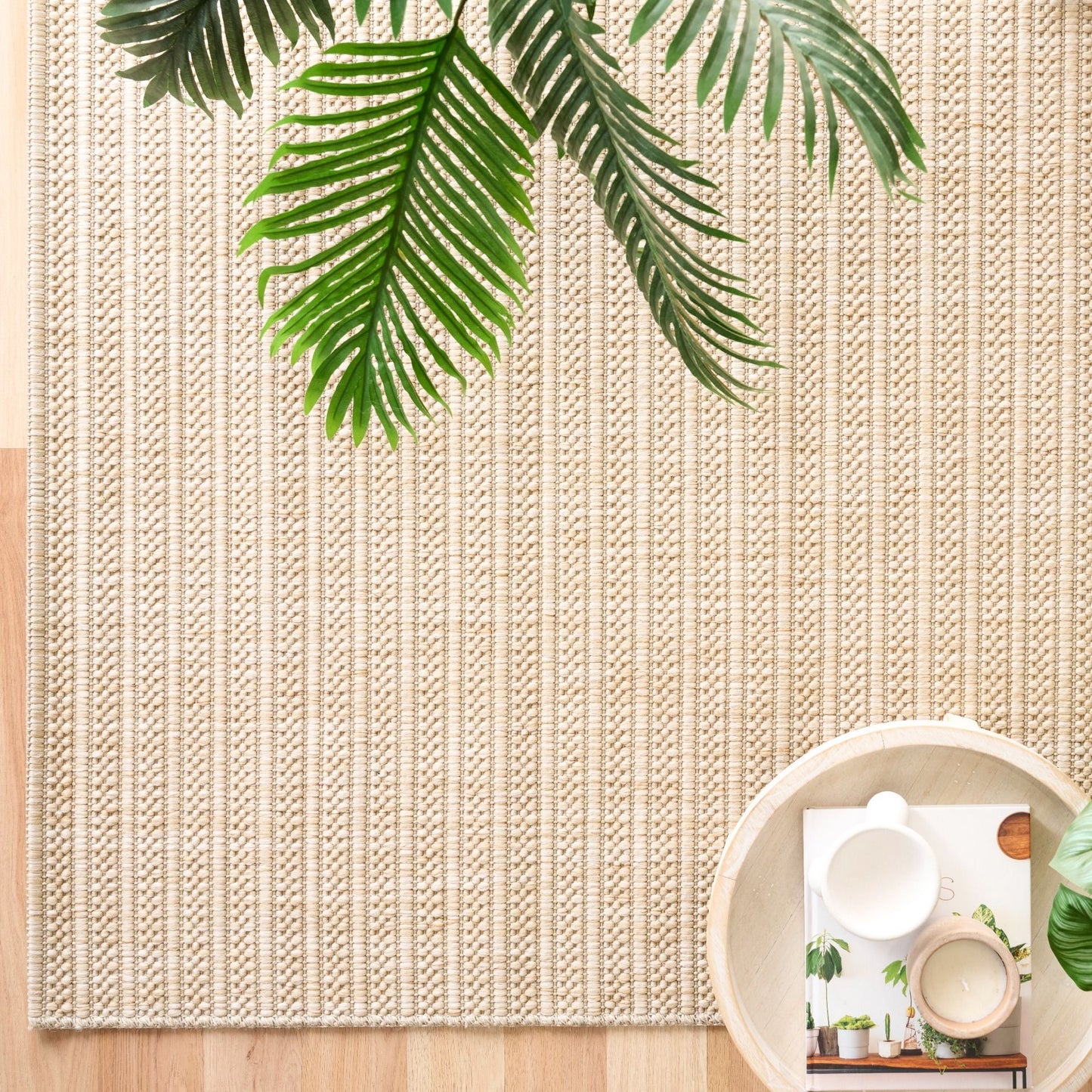 Barton Linear Cream indoor/outdoor rug featuring soft cream tones and a subtle textured pattern, power-loomed from UV-stabilised polypropylene for lasting durability. Colour Cream. 3 sizes. Life.