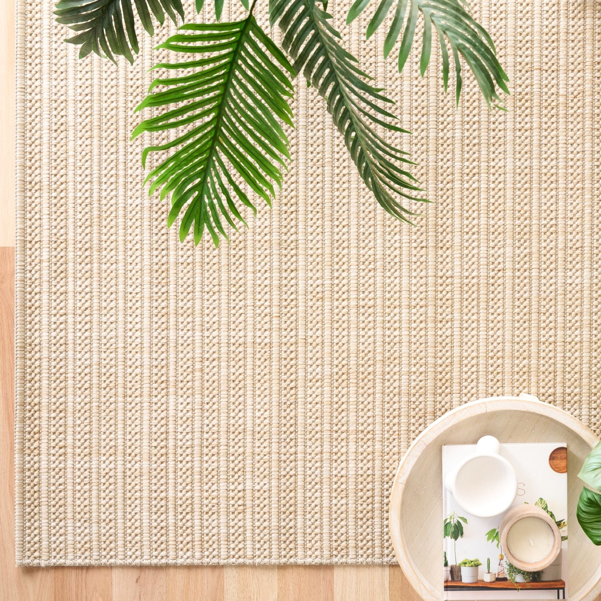 Barton Linear Cream indoor/outdoor rug featuring soft cream tones and a subtle textured pattern, power-loomed from UV-stabilised polypropylene for lasting durability. Colour Cream. 3 sizes. Life.