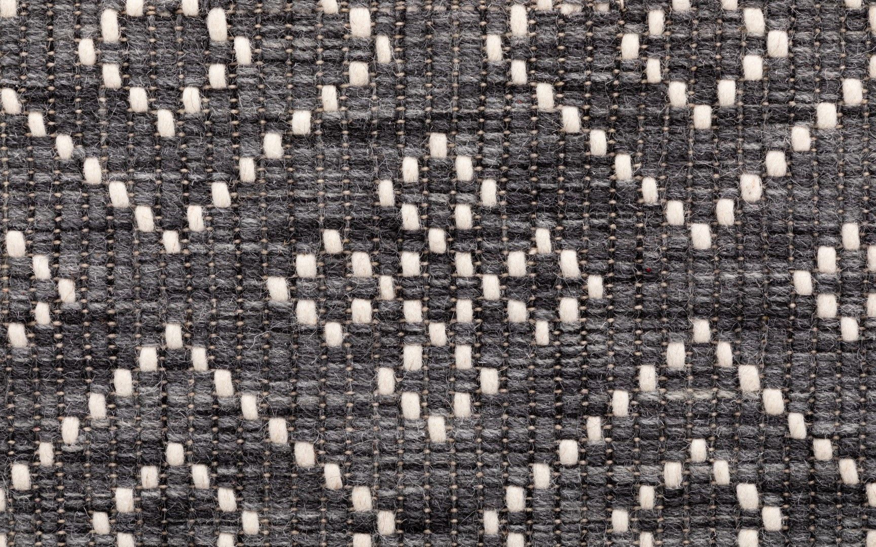 Bellevue Grey is a textured hand woven  wool and viscose rug.  Featuring a tribal diamond aztec design. Colours Grey with White Patterns. Sizes 155 X 225, 200 X 290 and 300 X 400. Close.