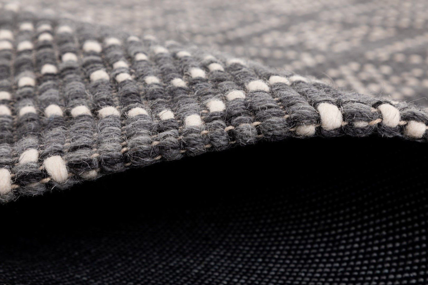 Bellevue Grey is a textured hand woven  wool and viscose rug.  Featuring a tribal diamond aztec design. Colours Grey with White Patterns. Sizes 155 X 225, 200 X 290 and 300 X 400. Side.