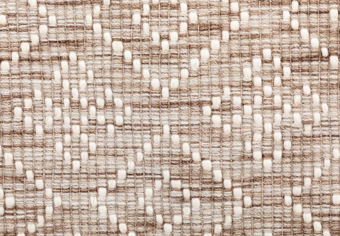 Bellevue Natural is a textured hand woven  wool and viscose rug.  Featuring a tribal diamond aztec design. Colours Beige/Cream with White Patterns. Size 300 X 400. Close.