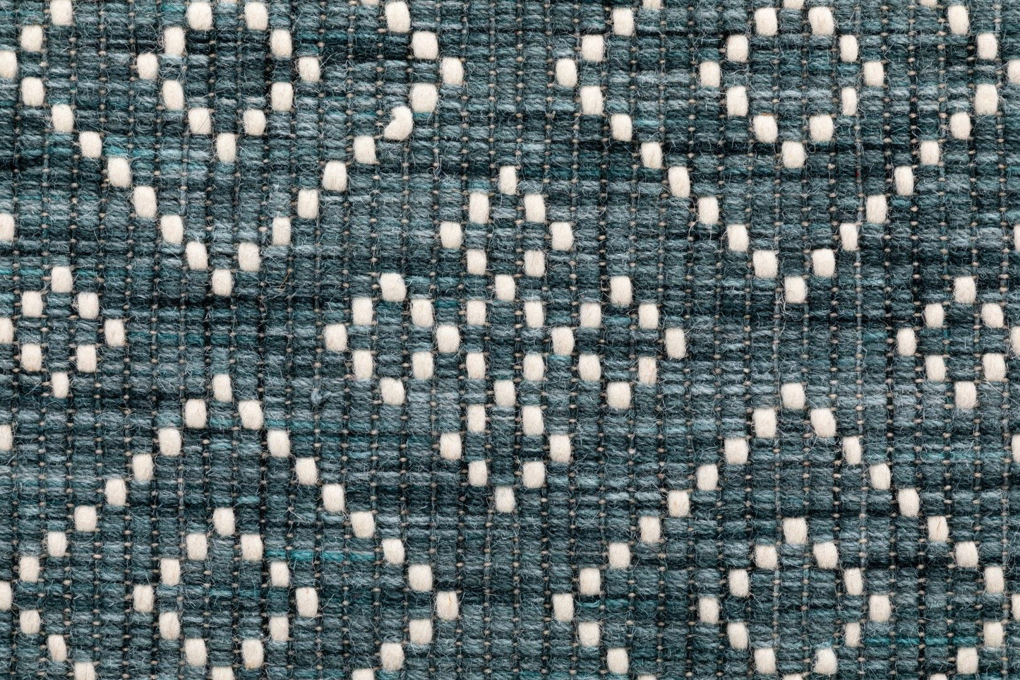 Bellevue Teal is a textured hand woven  wool and viscose rug.  Featuring a tribal diamond aztec design. Colours Teal Green with White Patterns. Sizes 200 X 290 and 300 X 400. Close.